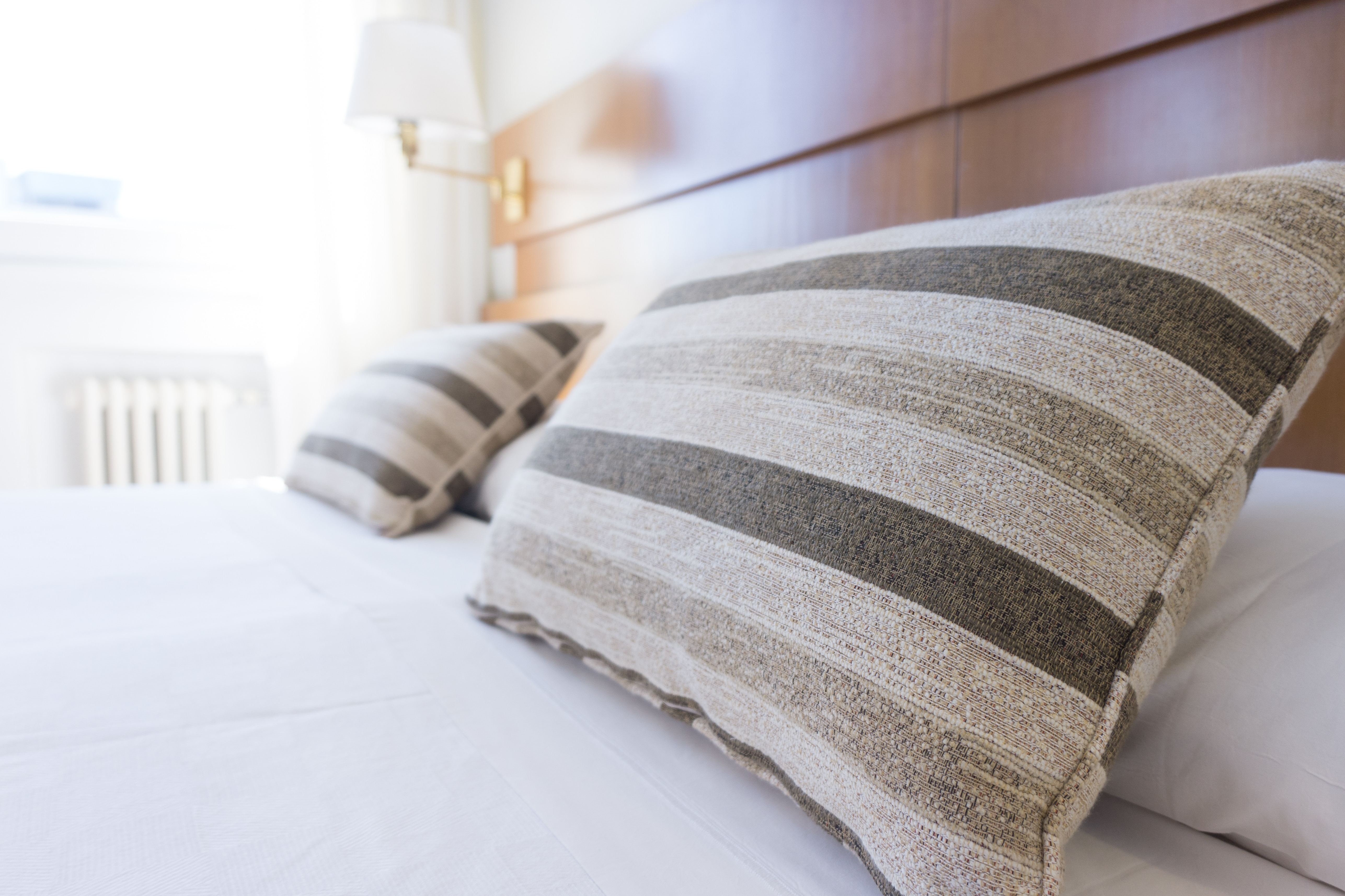 best hotels for business travel pillows on a bed