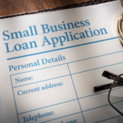 Small,Business,Loan,Application,Form,On,An,Office,Desk Image of a small business loan application to demonstrate How Cash Flow Impacts Business Loan Approval.
