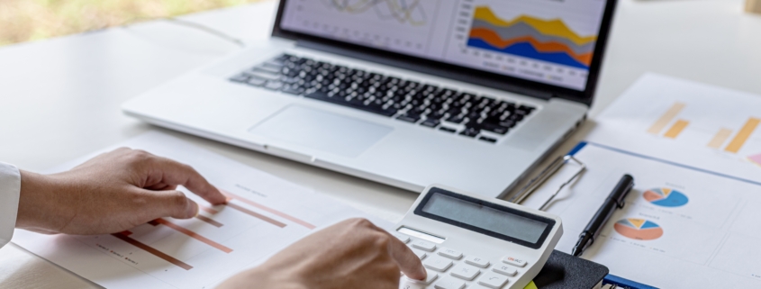Hands at a keyboard. A small business owner wonders How much working capital does your small business need?