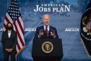 Joe Biden speaking at the conference about employment changes.