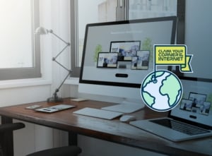 Laptop and a desktop lamp on the table with clipart image of the globe.
